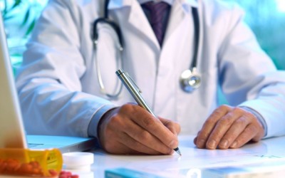 doctor writing prescription