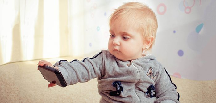 kid looking at smartphone