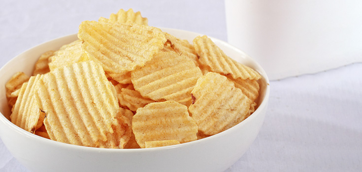 bowl of potato chips with ridges