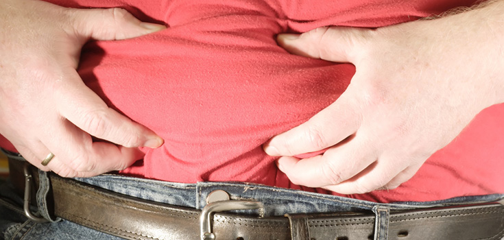 man holding stomach fat