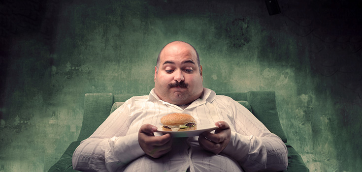 American lifestyle of obese man and hamburger