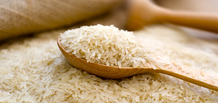 white rice and wooden spoon