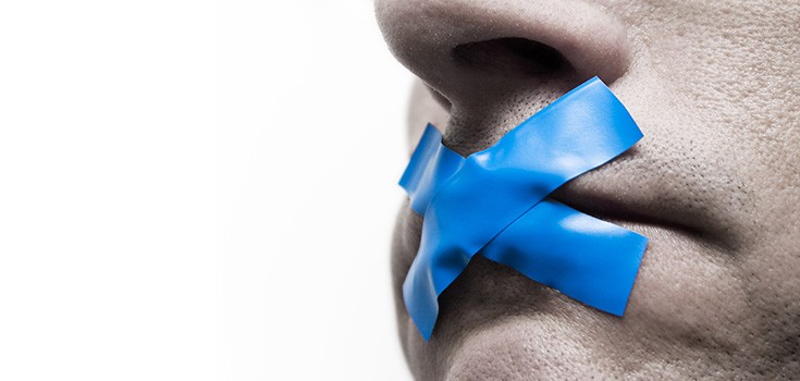 mouth with blue tape across it