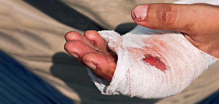 bleeding hand with a bandage