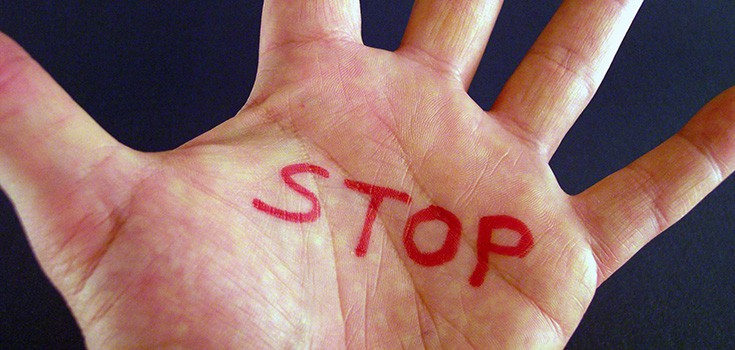 stop written on palm