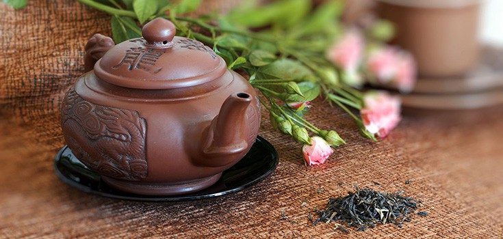 pot of green tea with flowers