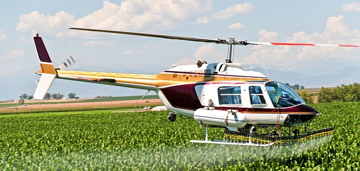 pesticides spray from helicopter