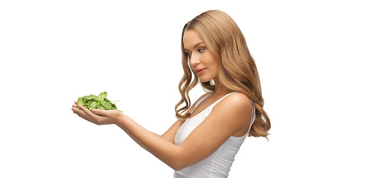 girl holding spinach