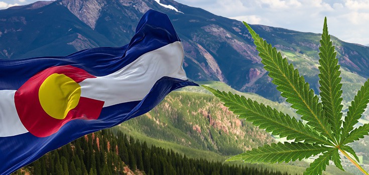 colorado flag and marijuana leaf on mountain background