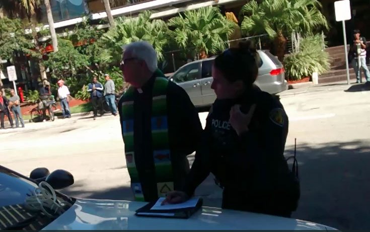 Video: Police Detain 90-Year-Old Priest for Feeding Homeless