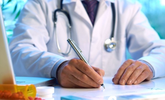 doctor writing prescription
